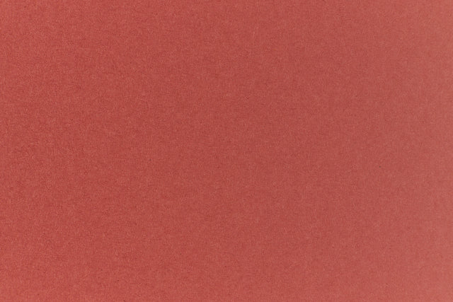 Brick red colored paper sample.