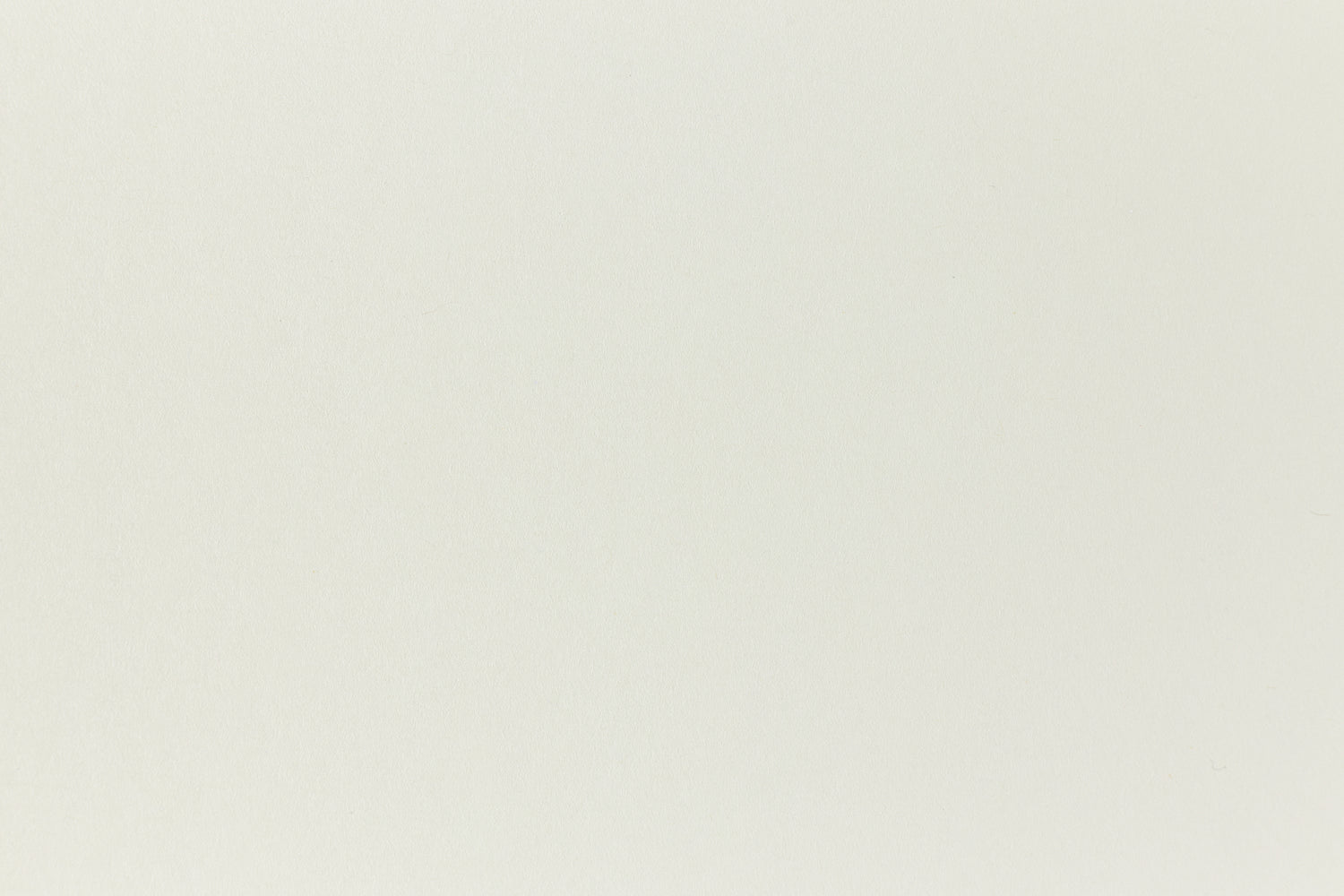 Very light green construction-style cardstock paper.