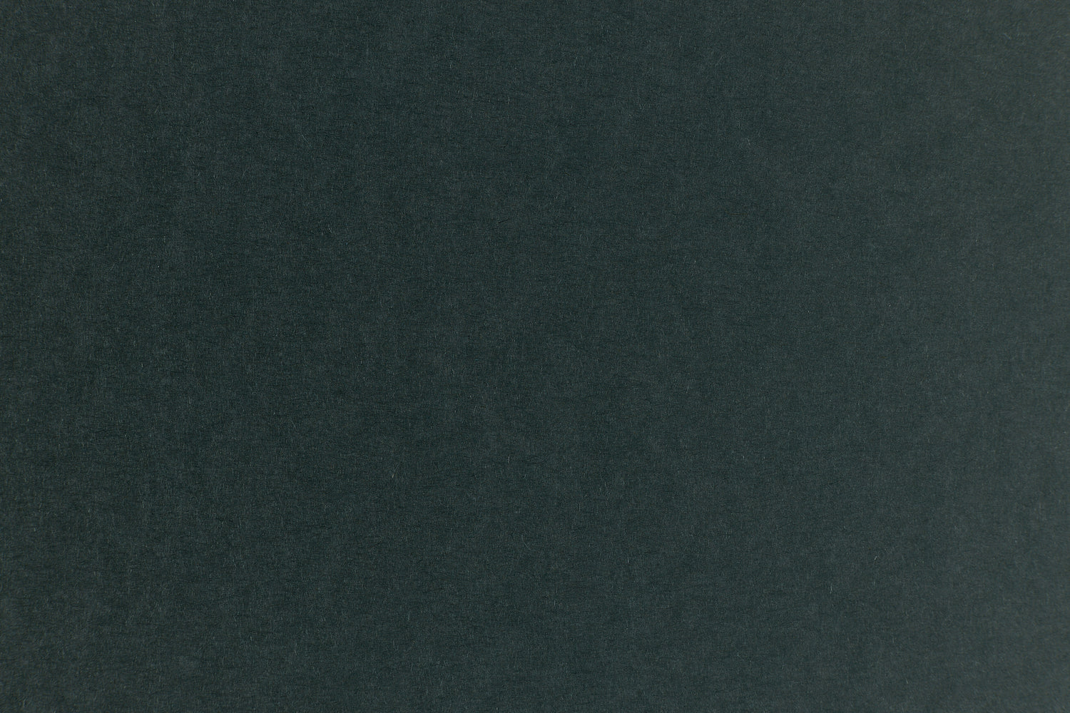 Dark green construction-style cardstock paper in close detail.