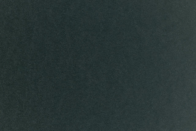 Dark green construction-style cardstock paper in close detail.
