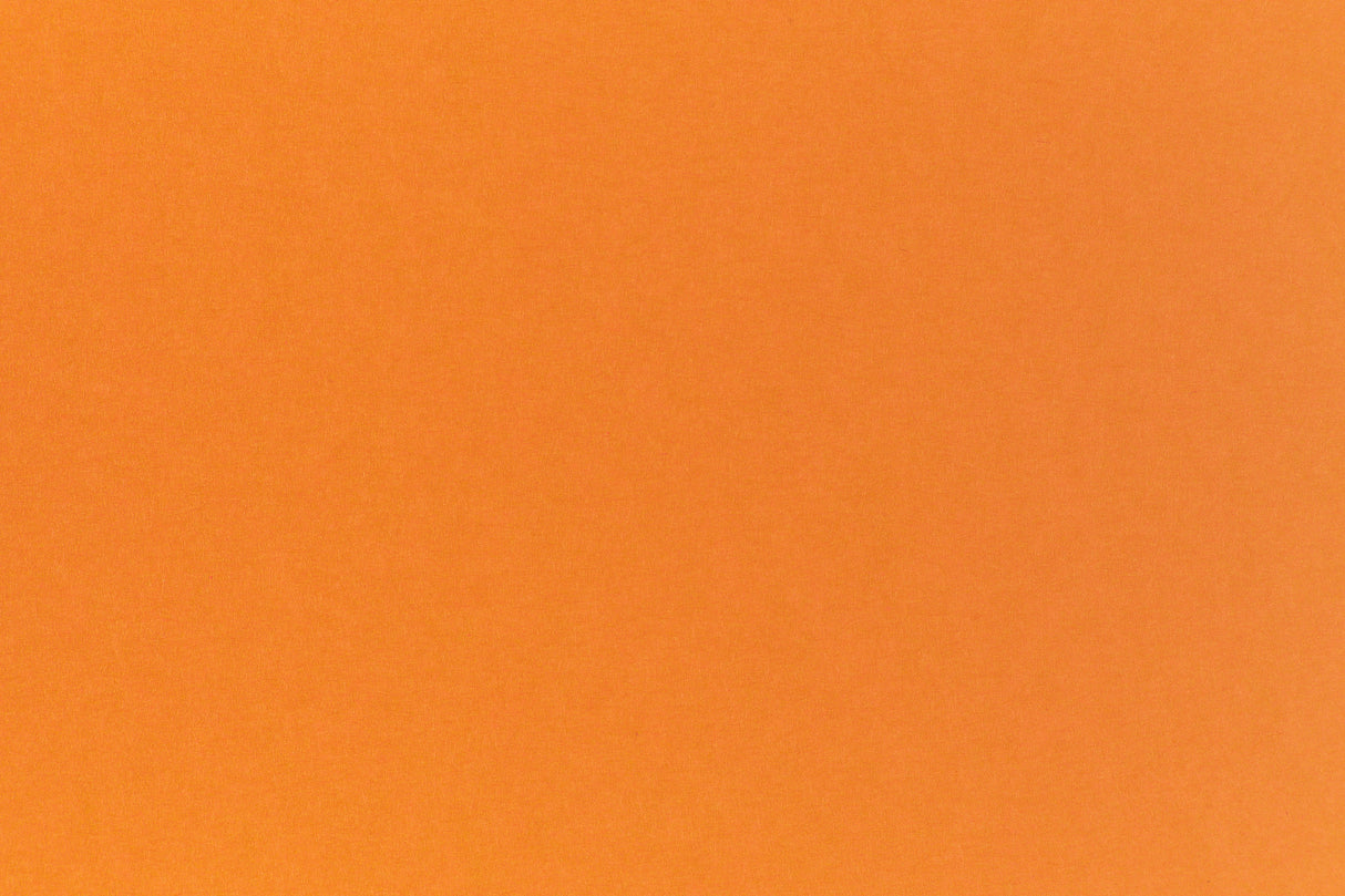 Bright neon orange cardstock paper sample.