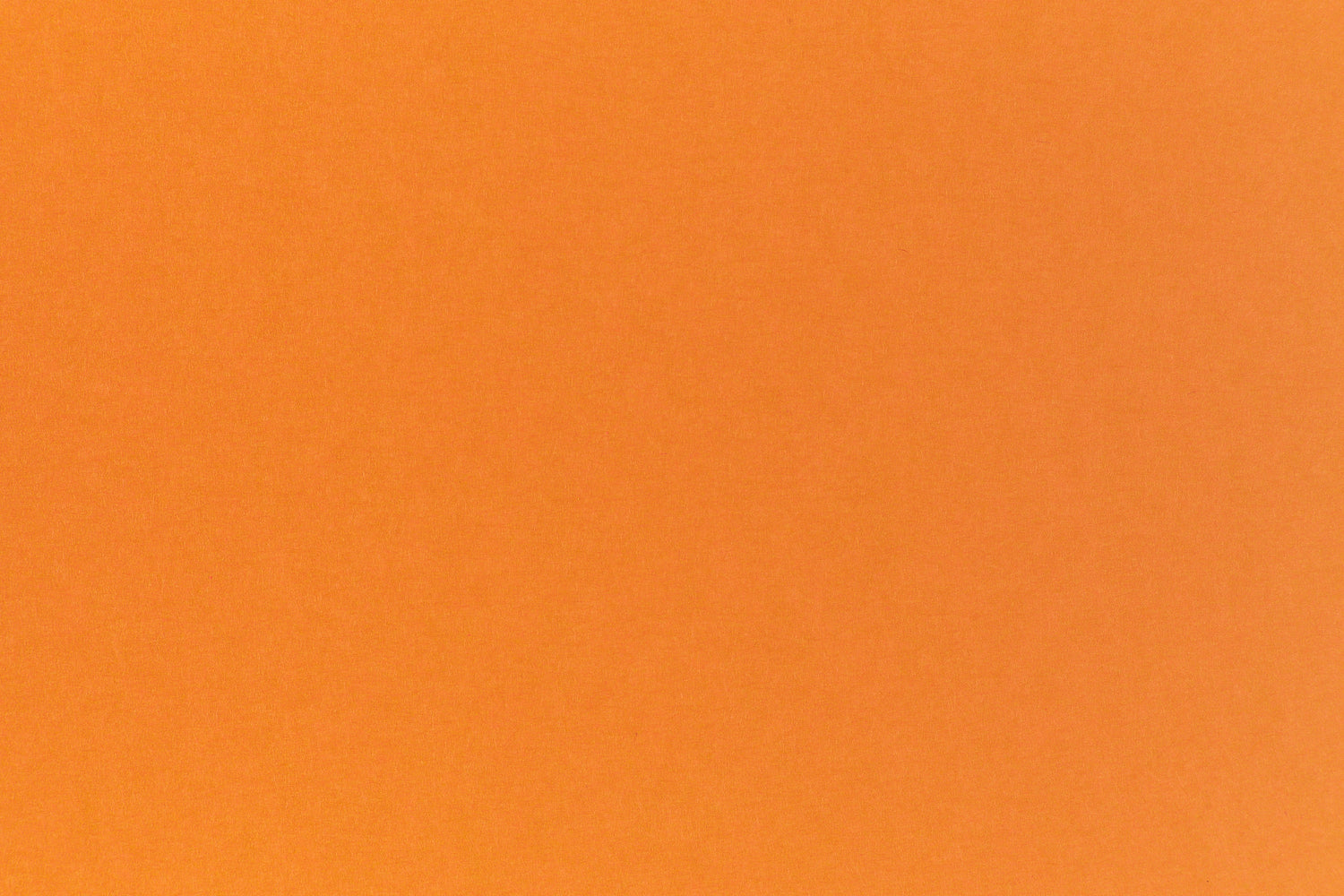 Bright neon orange cardstock paper sample.