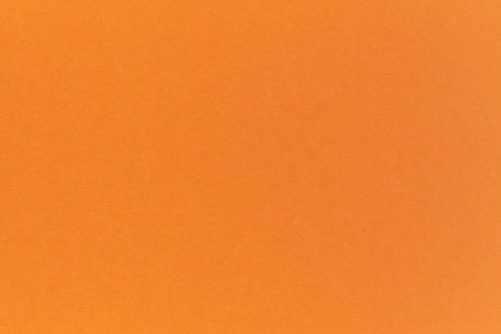 Bright neon orange cardstock paper sample.