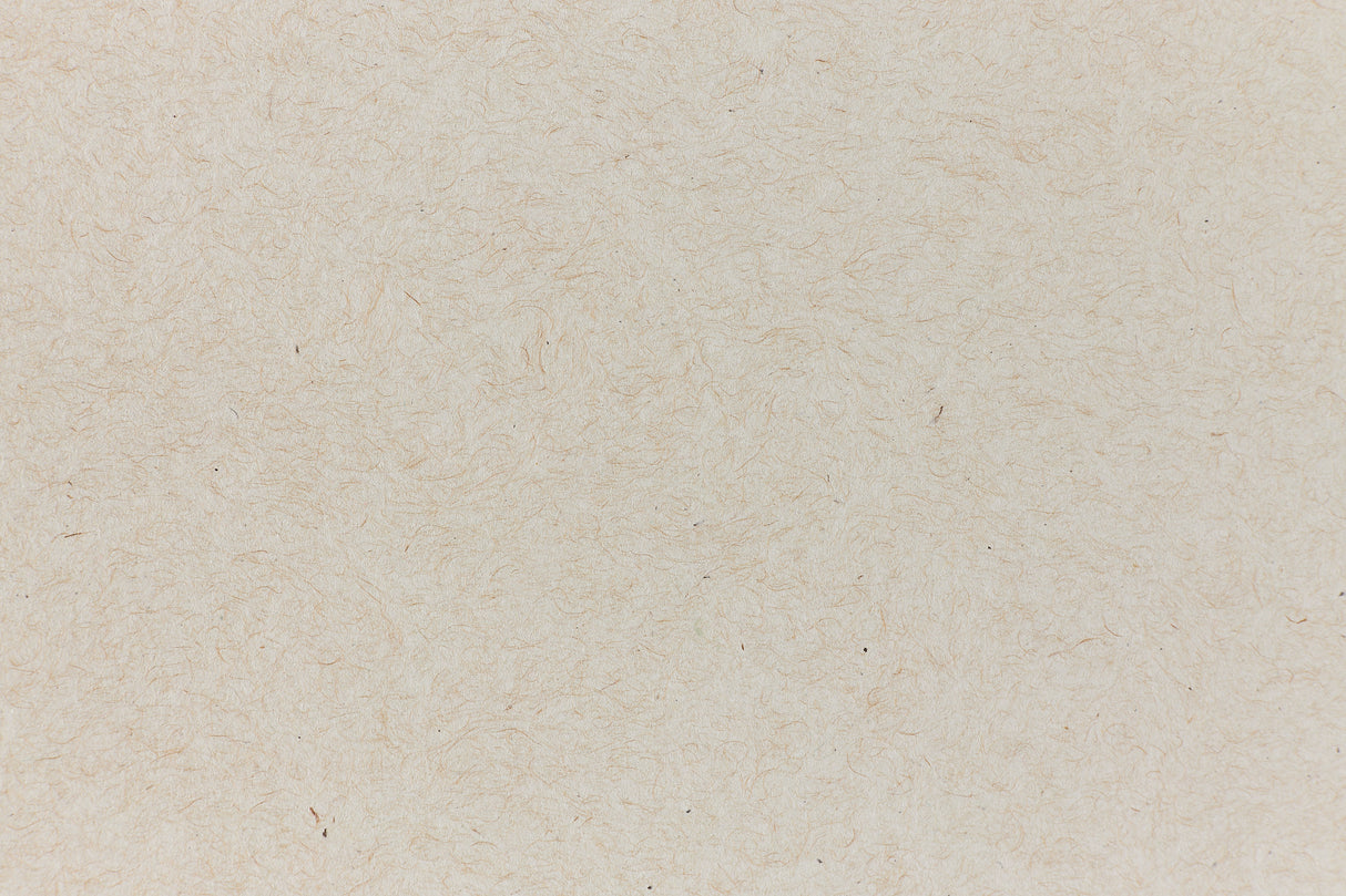 Light brown paper with swirling fibers.