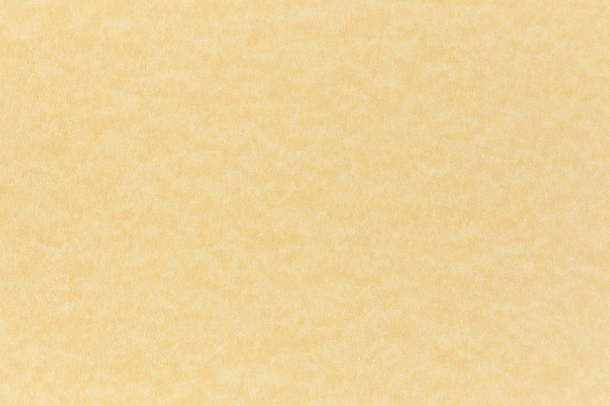 A subdued gold color paper viewed closeup.