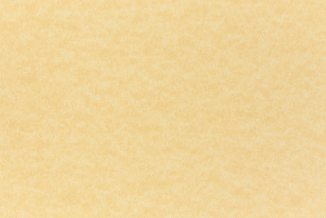 A subdued gold color paper viewed closeup.