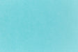 Bright blue paper viewed in detail.