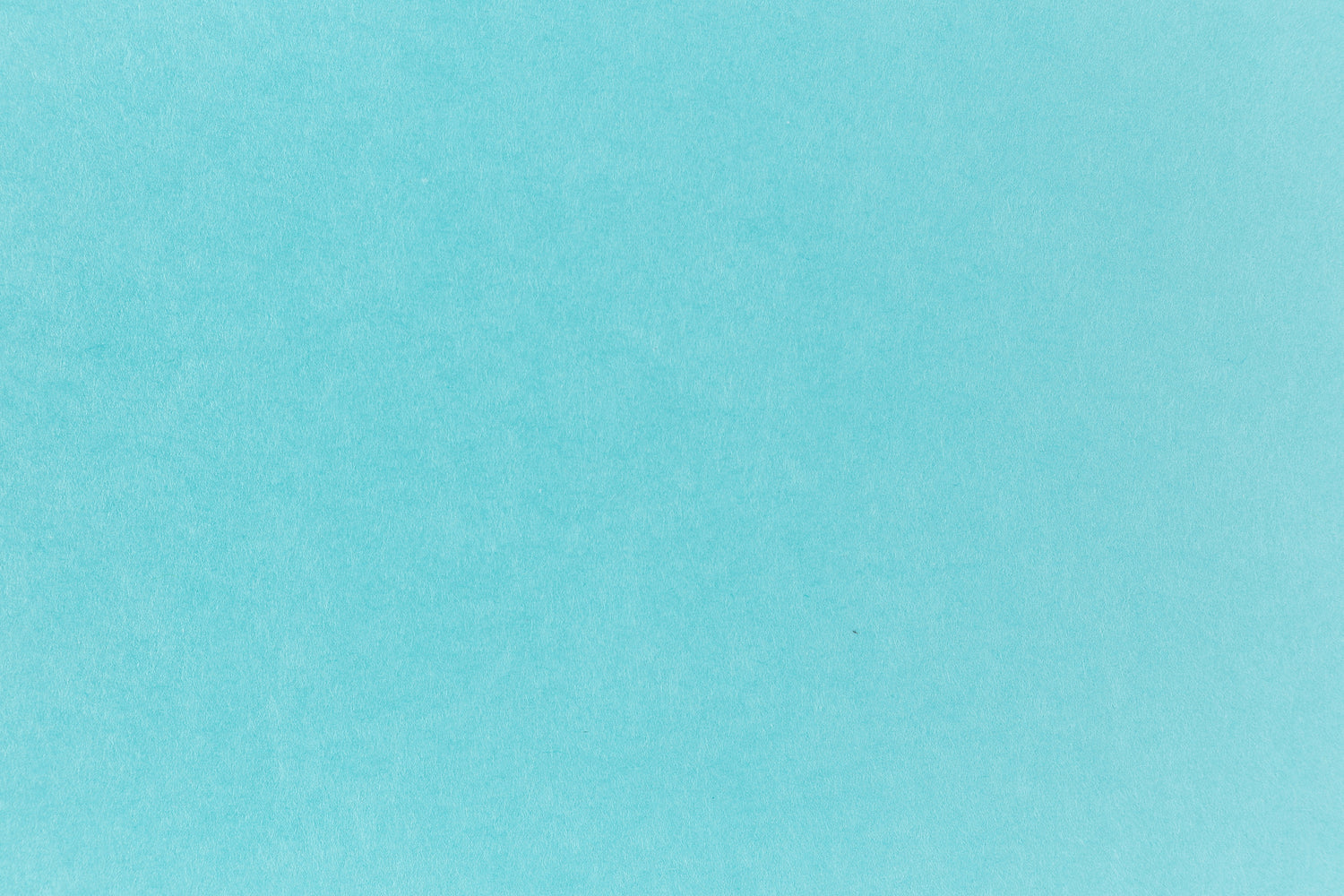 Bright blue paper viewed in detail.