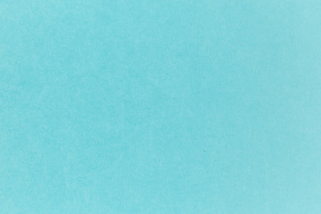 Bright blue paper viewed in detail.