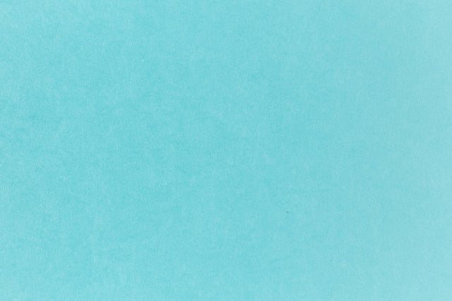 Bright blue paper viewed in detail.