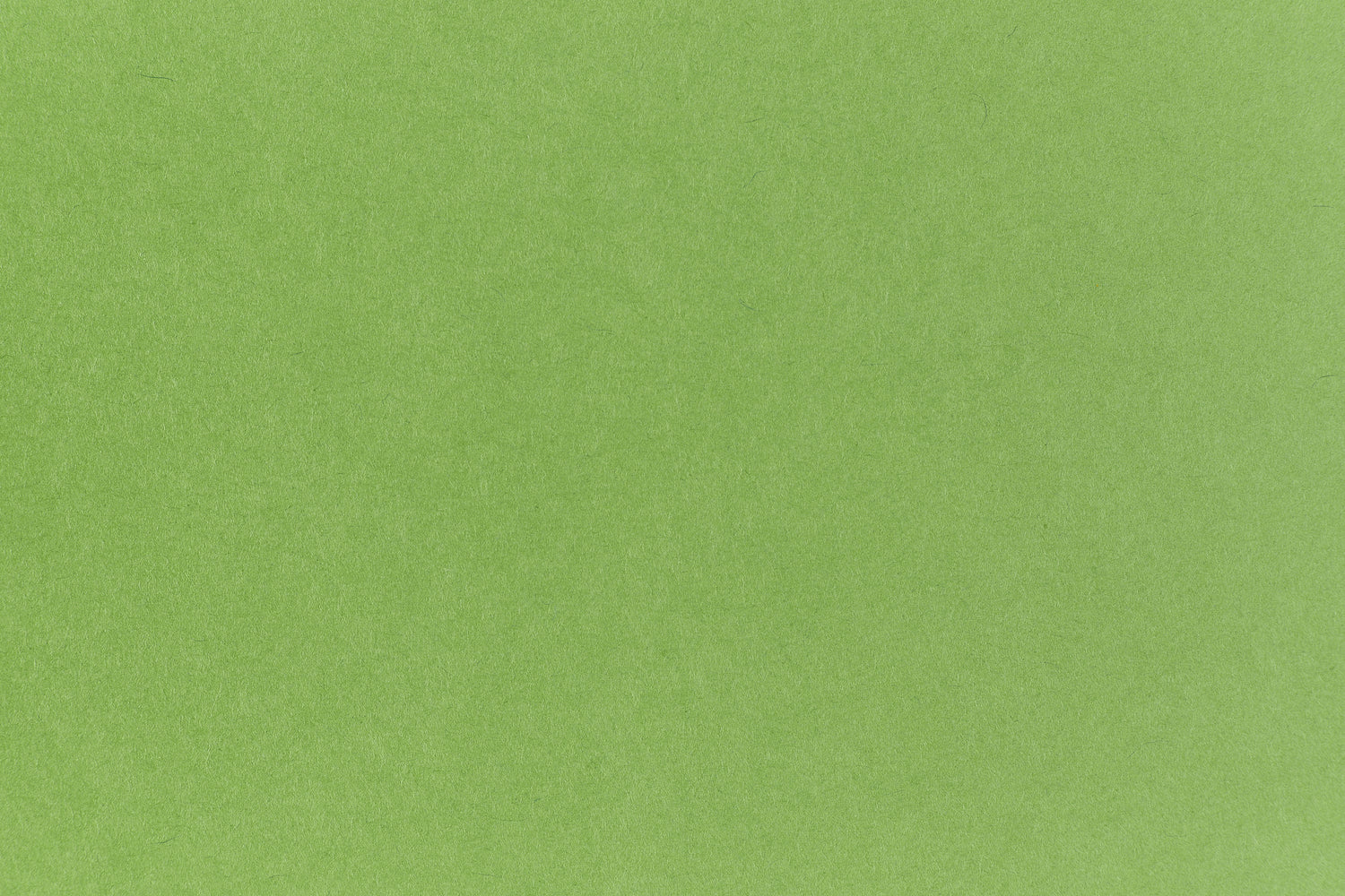 Neon green crafting paper viewed in close detail.