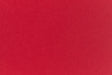 Bright red crafting paper viewed close up.