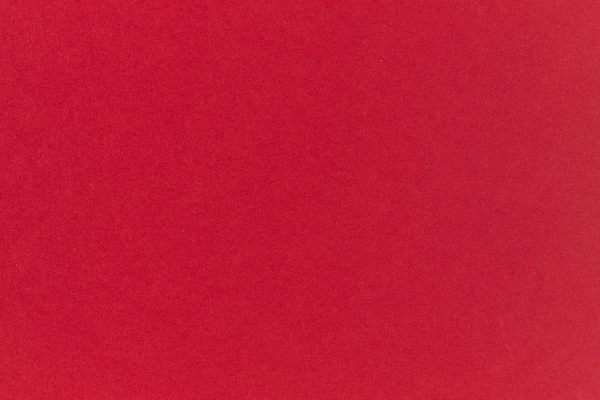 Bright red crafting paper viewed close up.