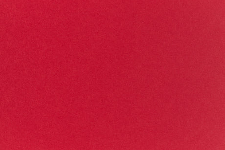 Bright red crafting paper viewed close up.