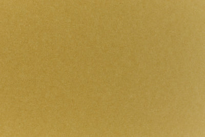 Close up view of green construction-style cardstock paper. 