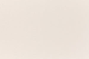 A soft, light pink construction-style cardstock paper viewed closeup.