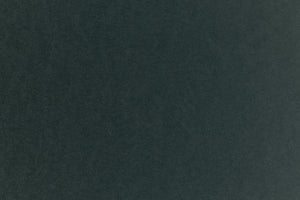 Dark green construction-style cardstock paper in close detail. 