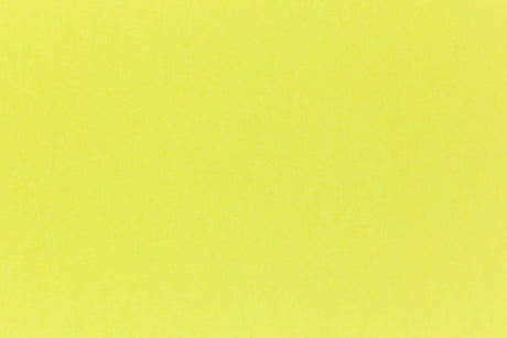 Brilliant neon yellow cardstock paper in close detail. 