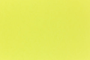 Brilliant neon yellow cardstock paper in close detail. 
