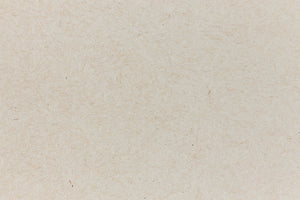 Light brown paper with swirling fibers. 
