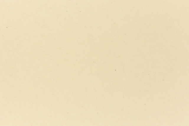 Deep yellow crafting paper shown in close detail. 