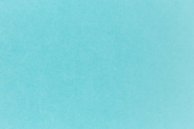 Bright blue paper viewed in detail. 