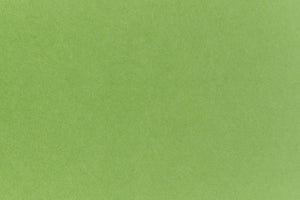 Neon green crafting paper viewed in close detail.