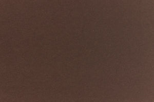 A deep and dark brown-black paper viewed in close detail. 