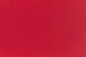 Bright red crafting paper viewed close up. 