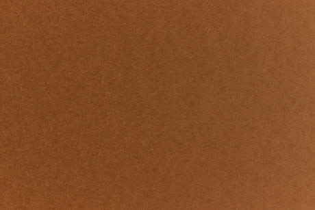 Brown crafting paper with a speckled appearance. 